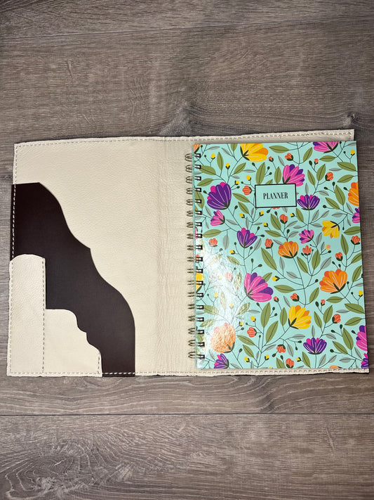 Brown and white cowhide planner