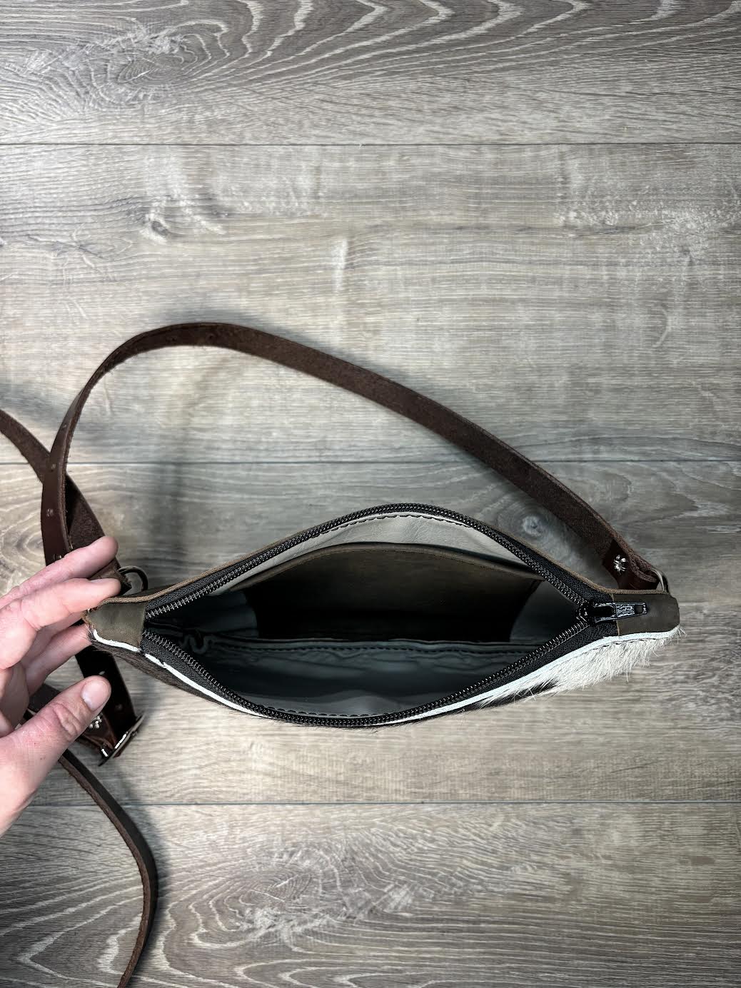 Black and white hair on hide clutch