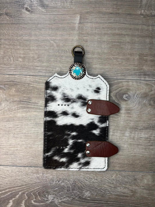 Trophy buckle display black and white hair on hide and turquoise, silver, and copper concho