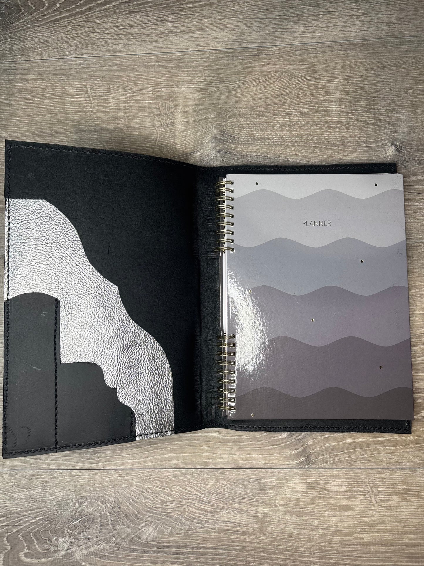 Black and white cowhide planner