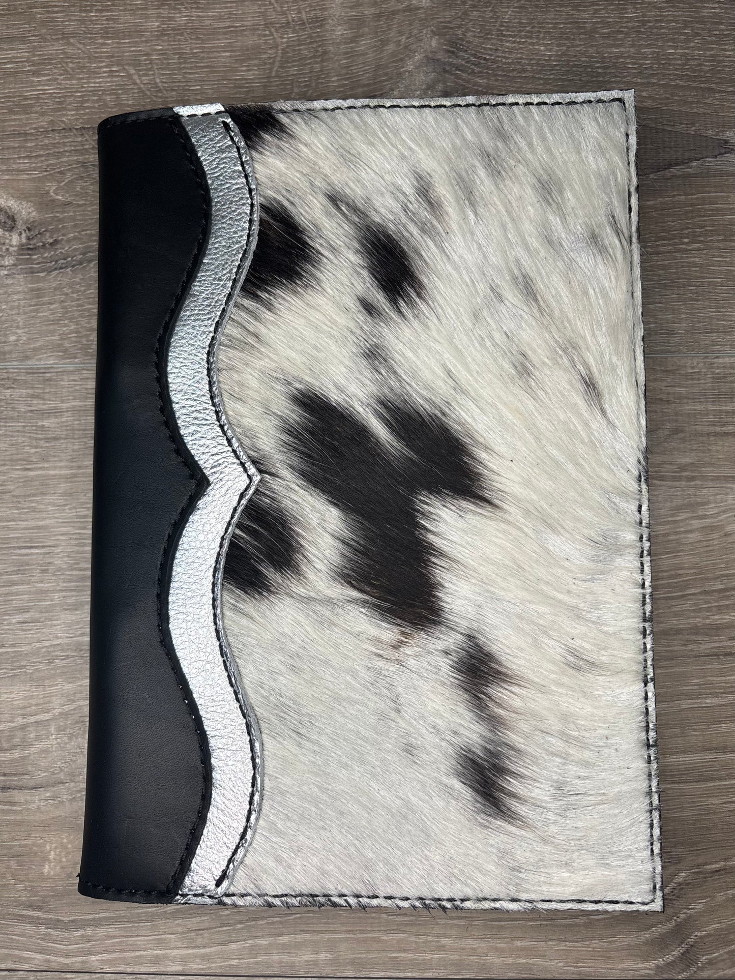 Black and white cowhide planner